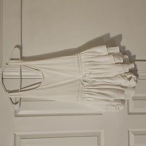 White one-piece, ruffled short bottom